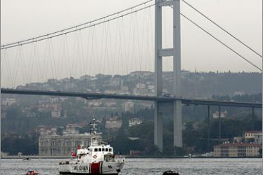REUTERS/Turkish coast guard boats patrol the Bosphorus straits next to the Bosphorus Bridge during the Iraqi conference held at Ciragan Palace in Istanbul