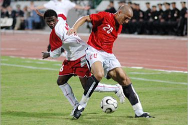 AFP / Emirati player Ismail al-Hamadi (L) vies for the ball with Egyptian player Wael Gomaa (R) during their football match at the 11th Pan-Arab Games in Ismailia, 13 November 2007.
