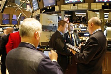 r_Traders work on the floor of the New York Stock Exchange in New York December 13, 2007. U.S. stocks opened slightly lower as stronger-than-expected retail sales data was offset