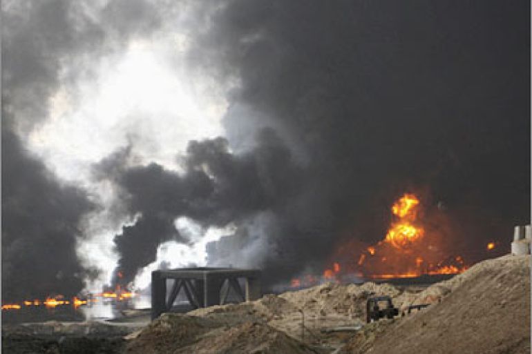 REUTERS/A cloud of smoke rises from a burning oil pipeline in Baiji, 180 km (112 miles) north of Baghdad December 7, 2007. A fire erupted in an internal