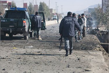 AFPAfghan policemen walks at the site of a suicide attack in Kandahar, south east of Kabul,