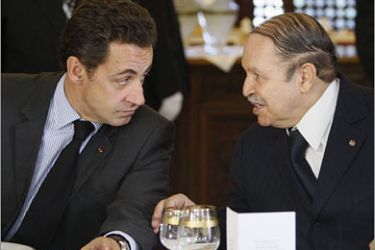 REUTERS/France's President Nicolas Sarkozy (L) and Algeria's President Abdelaziz Bouteflika have lunch in Algiers on the second day of a three