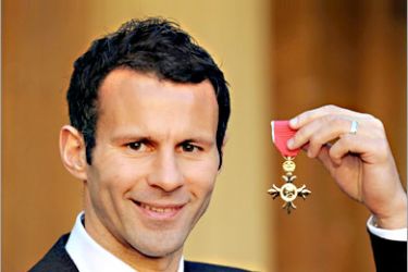 AFP / Manchester United and Wales footballer Ryan Giggs is pictured after receiving an Order of the British Empire (OBE) for services to football by Queen Elizabeth II at Buckingham Palace in central London, 11 December 2007. Ryan, 34, has played more than 500 games for Manchester United and has been capped 64 times for Wales. AFP PHOTO/FIONA