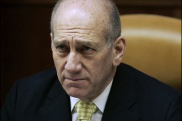 r-Israel's Prime Minister Ehud Olmert attends the weekly cabinet meeting in his office in Jerusalem January 13, 2008.