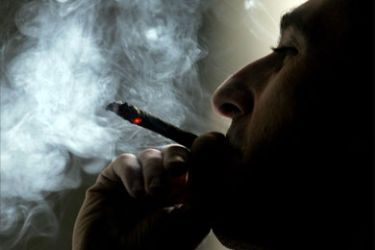 : A Turkish man smokes at a teahouse in Istanbul, Turkey, 08 January 2008. Parliament in Turkey has voted to introduce a blanket ban on smoking in enclosed public places