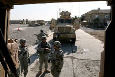 F/US soldiers from the 4th Battalion, 64th Armorer Regiment prepare to leave their base on a mission in Baghdad, 06 January 2008. A US soldier died today when his patrol vehicle was struck by a roadside bomb in Baghdad, the US military said. The latest deaths bring the total number of American soldiers killed since the 2003 US-led invasion to 3,909, according to an AFP tally based on independent website www.icasualties.org figures. AFP POHTO/Jewel SAMAD