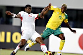 REUTERS/ Radhi Jaidi (L) of Tunisia challenges Sibusiso Zuma of South Africa during their African Nations Cup Group D soccer match in Tamale January 27, 2008. REUTERS/Finbarr