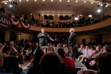 Republican presidential hopeful Sen. John McCain (R-AZ) (L) answers questions with friend Sen. Joe Lieberman (I-CT) during a town hall meeting at the Adams Opera House 03 January 2008 in Derry, New Hampshire