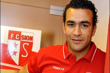 AFP PHOTO / Egypt's goalkeeper Essam al-Hadary poses close to the logo of the FC Sion football club, on February 23, 2008