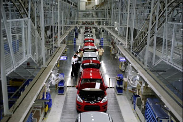 f/Employees of Hyundai Motor India Limited work in the newly inaugurated auto plant in Sriperumbudur, around 45 kms north of the southern Indian city of Chennai, 02 February 2008