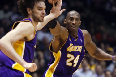 Los Angeles Lakers guard Kobe Bryant (24) congratulates forward Pau Gasol after he scored a layup against the New Jersey Nets in the fourth quarter of their NBA basketball game in East Rutherford, New Jersey, February 5, 2008