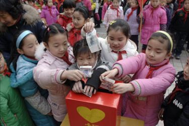 A group of Chinese children contribute on behalf of their families to the relief fund for the victims of the recent severe winter weather, in Hefei, central China's Anhui province on February 15 2008