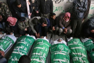 Palestinian relatives of seven Hamas’ members killed during an Israeli air raid the previous day in Khan Yunis in the Gaza Strip mourn during their funeral on February 6, 2008.