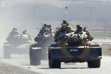 Turkish tanks move near the southeastern Turkish town of Silopi, near the Iraqi border, February 22, 2008. Turkey has sent two brigades numbering "thousands of troops" into