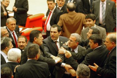 Turkish parliamentarians argue during a debate on a constitutional reform at the Turkish Parliament in Ankara, 06 February 2008