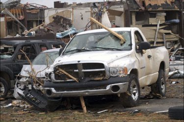 r - heavily damaged vehicles while surveying storm damage on the campus of Union University in Jackson, Tennessee February 6, 2008. Tornadoes and thunderstorms shattered