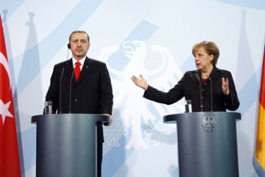 Turkish Prime Minister Recep Tayyip Erdogan and German Chancellor Angela Merkel address a joint press conference after a discussion with school students at the Chancellory