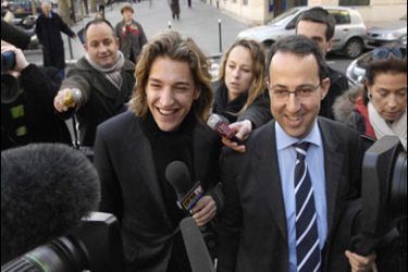 AFP PHOTO/French President Sarkozy's son Jean Sarkozy (L) and UMP party member Arnaud Teulle (R) speak to the press on February 11, 2008