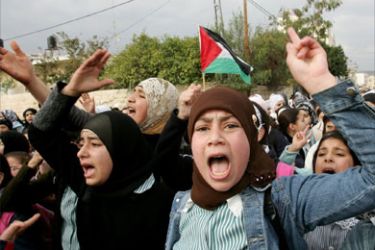 Palestinian students protest against the Israeli assault on the Gaza Strip in the West Bank city of Jenin on March 2, 2008.