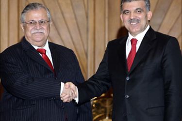 r_Turkish President Abdullah Gul (R) and his Iraqi counterpart Jalal Talabani (L) pose at the entrance of Gul's office in Ankara March 7, 2008. Talabani visited the Turkish capital