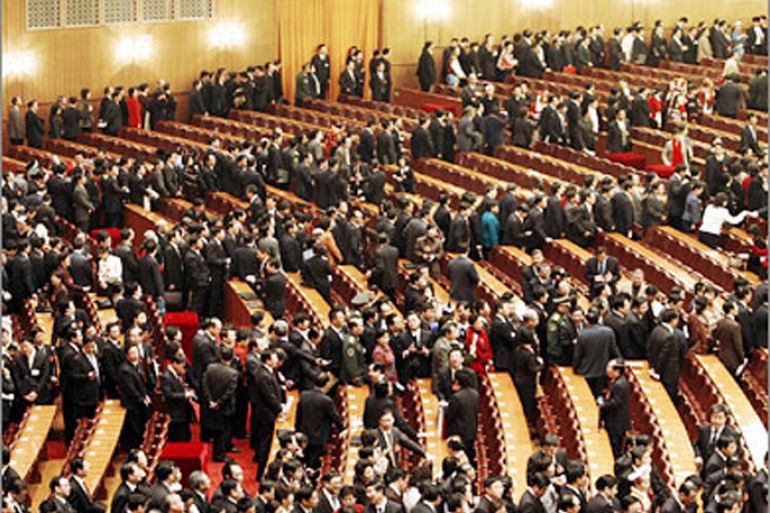 REUTERS/Delegates queue to leave after the second plenary session of China's parliament