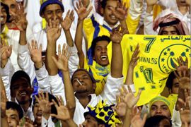 AFPSaudi fans of Al-Nasr club cheer on their team against opponents Al-Shabab during their Prince Faisal championship semi