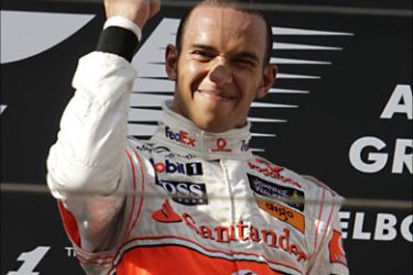r_McLaren Formula One driver Lewis Hamilton of Britain celebrates winning the Melbourne F1 Grand Prix March 16, 2008. REUTERS/Mark Horsburgh (AUSTRALIA)