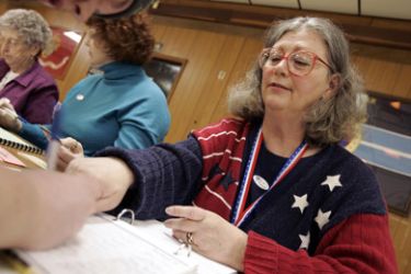 Poll worker Ruth Ann Beaverson helps sign in a voter on March 4, 2008, in Bowling Green, Ohio. Polls show Democratic presidential hopefuls Sen. Hillary Clinton (D-NY)