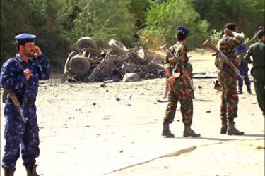 f_Yemeni security forces inspect the scene of a bomb blast in which three Yemeni policemen were killed and four wounded on April 16, 2008 when in the city of Marib, around 170