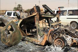 f_An Iraqi Army humvee destroyed in fighting with Shiite militias sits in the middle of the road in the southern city of Basra on April 02, 2008. The Iraqi government's failure to wipe