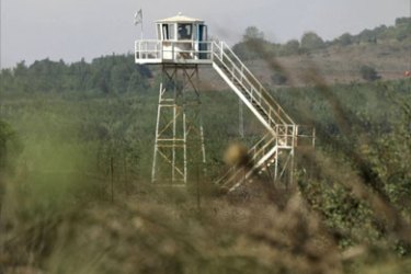 A picture taken from the Quneitra checkpoint shows an Israeli military watch tower in the Israeli-occupied Golan Heights on September 6, 2007
