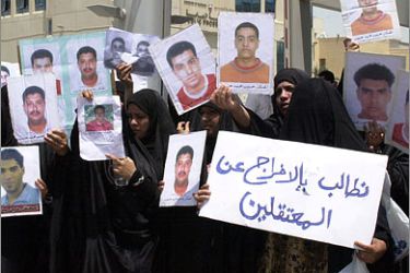 AFPMothers of jailed Bahraini opposition activists hold pictures of their sons during a protest in front of Bahrain's Public Prosecution Bureau in Manama