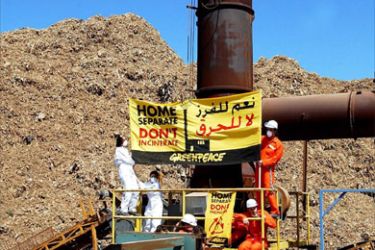Greenpeace demonstrators get their message across during their blockade of the Normandy incinerator in Beirut Tuesday 27th May 2003