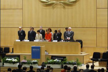 r/Delegates observe one minute of silence in the memory of the victims in Myanmar and China at the 61st World Health Assembly at the United Nations European headquarters in Geneva May 19, 2008.