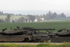 Israeli tanks are seen stationed near Sderot in southern Israel, some kilometers away from the Gaza Strip, on March 3, 2008. Prime Minister Ehud Olmert vowed today that Israel