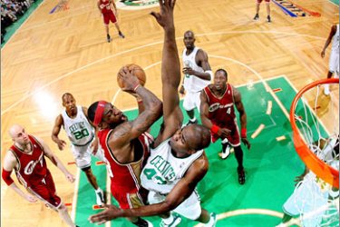 AFP Kendrick Perkins #43 of the Boston Celtics tries to block a shot by LeBron James #23 of the Cleveland Cavaliers during Game One of the Eastern