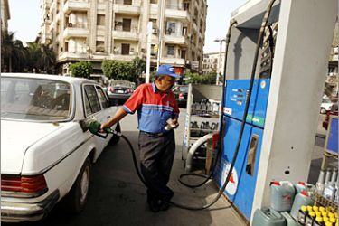 REUTERS /An Egyptian man fills his car with petrol at a gas station in Cairo, May 5, 2008. An Egyptian parliament majority agreed on Monday to steep increases in fuel, cigarette prices and