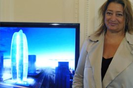 Iraqi-born architect Zaha Hadid stands on May 21, 2008 in Warsaw, next to a computer-generated image of her design for the 250m high "Lilium Tower" building which will be constructed by 2012 in Warsaw