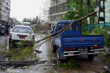 Tree branches lay across the back of a truck in a street blocked following a powerful cyclone in Myanmar's capital Yangon on May 3, 2008. Severe tropical cyclone Nargis