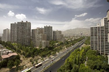 A general view of residential buildings in north western Tehran May 17, 2008. Negar Ehteshami just paid the equivalent of $6 million in rials in cash for a luxurious