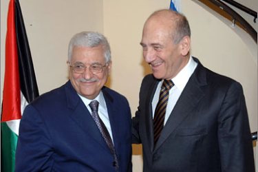 AFP A handout picture released by the Israeli government press office shows Israeli Prime Minister Ehud Olmert (R) shaking hands with Palestinian