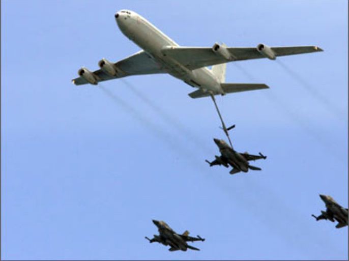 f/An Israeli plane KC-135 Stratotanker Boeing 707 refuels an F-16C Fighting Falcon during a military parade marking Israel’s 60th anniversary on May 8, 2008