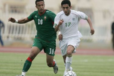 Algeria's Metref Hocine (R) and Morroco's Daoudi Nabil (L) fight for the ball during their African Nations Championship Qualifier first leg soccer match in Algiers