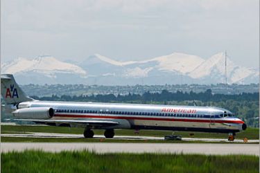 REUTERS/ An American airlines plane lands at the Calgary International Airport in Calgary, Alberta, June 17, 2008. The airlines industry focus now appears to be on various strategic alliances and large-scale capacity cuts. Last week, US