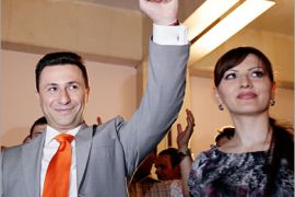 REUTERS/ Macedonian Prime Minister and leader of the ruling VMRO-DPMNE, Nikola Gruevski, greets his supporters next to his wife Borkica in Skopje, June 2, 2008. Gruevski's party