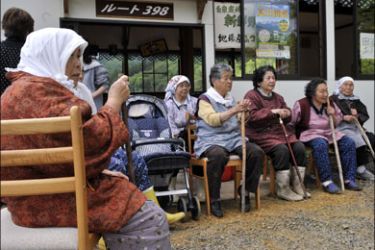 afp : Elderly people wait for rescue operations at a community center at a mountain village after the road was bocked by a landslide in Kurihara city, Miyagi prefecture,