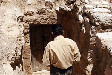 AFP - A Jordanian worker descends to a cave under the church of Saint Georgeous in the northern Jordanian town of Rihab on June 10, 2008, thought by Archaeologists to be the very first