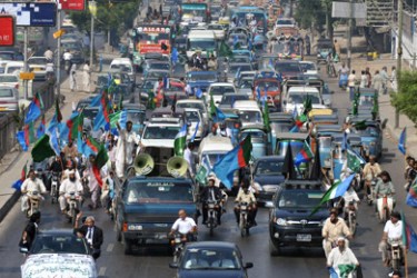AFP/ Pakistani political parties activists and lawyers drive their vehicles during a rally against President Pervez Musharraf in Karachi on June 9, 2008.
