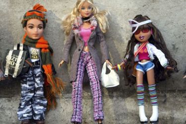 MGA's Bratz dolls and a Mattel Barbie Doll (C) are seen at the Dream Toys 2004 exhibition, sponsored by the Toy Retailers Association in London