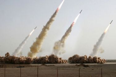 In a handout picture released on the news website of Iran's Revolutionary Guards, four long and medium range missiles rise into the air after being test-fired at an undisclosed